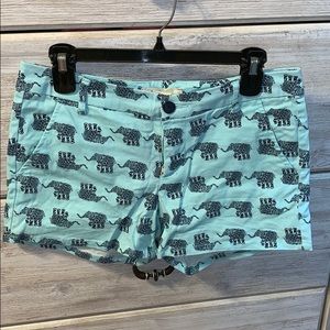 Turquoise denim shorts with navy elephants.